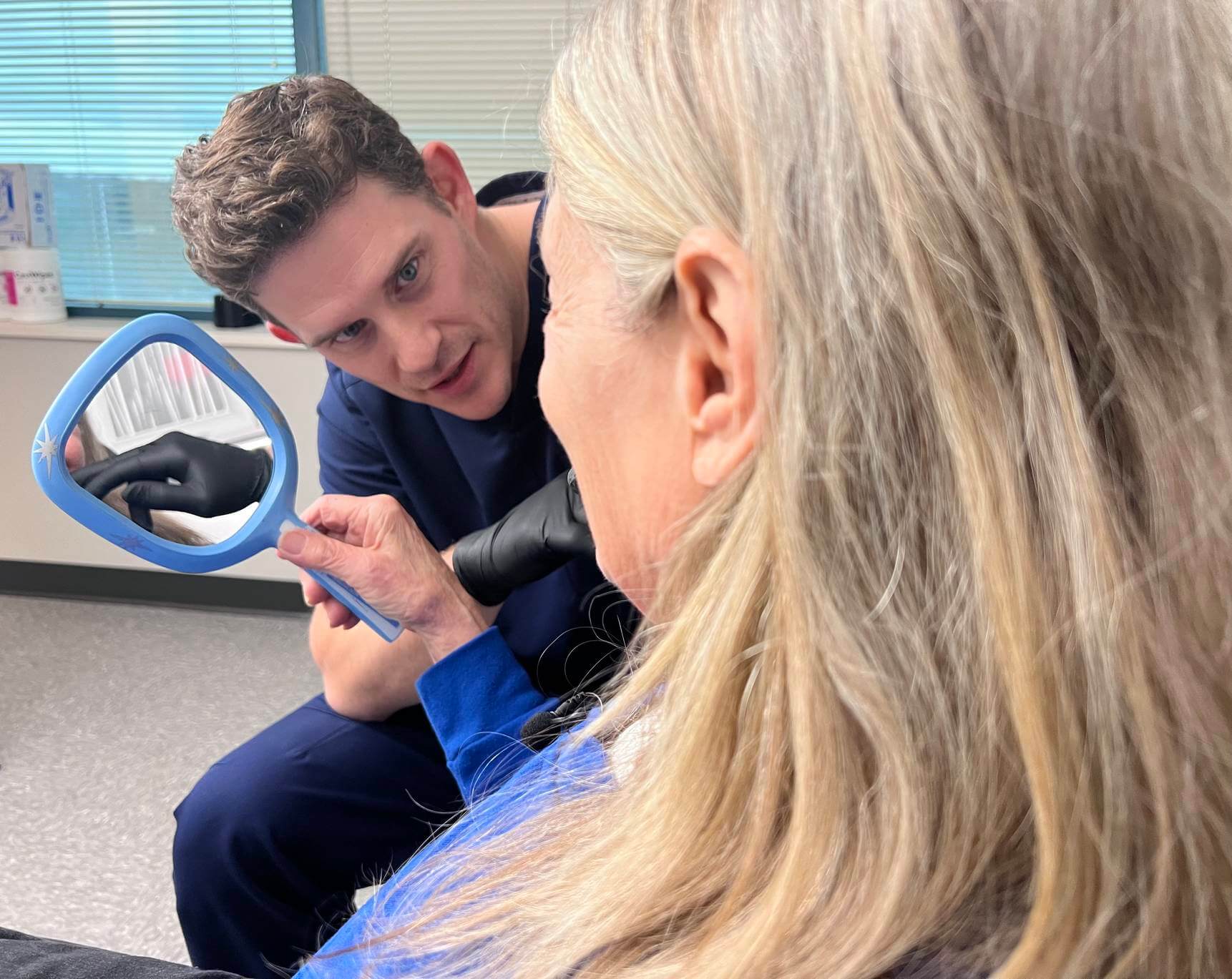 A full-arch implant patient at Nashville Dental Implants — same-day teeth delivered by Dr. Elliott DeWeese